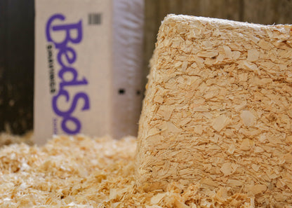 Bedsoft Shavings bedding poured into a stable
